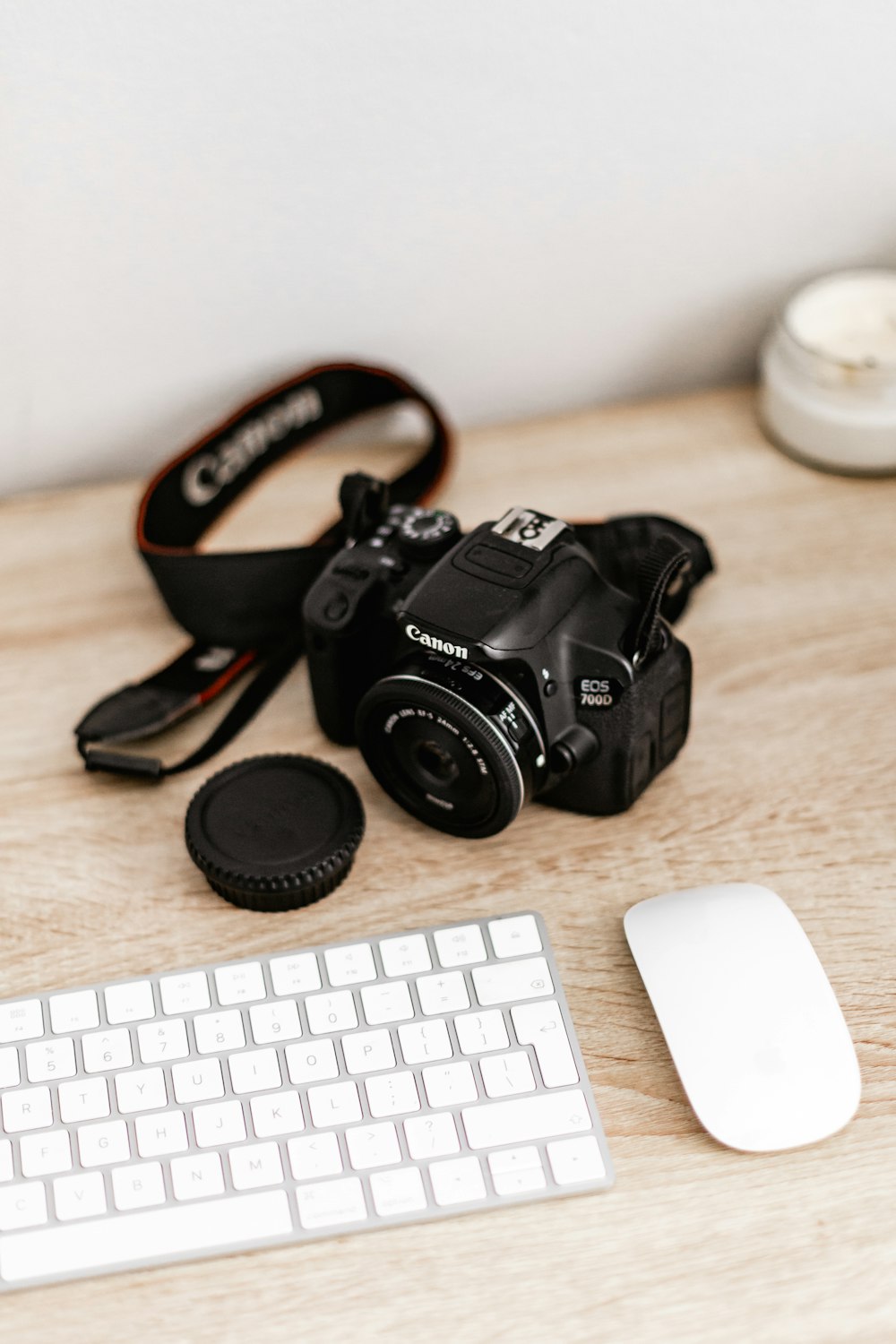 black nikon dslr camera on brown wooden table