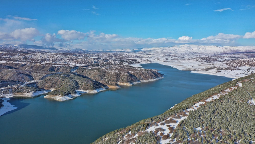 aerial view of lake and mountains during daytime