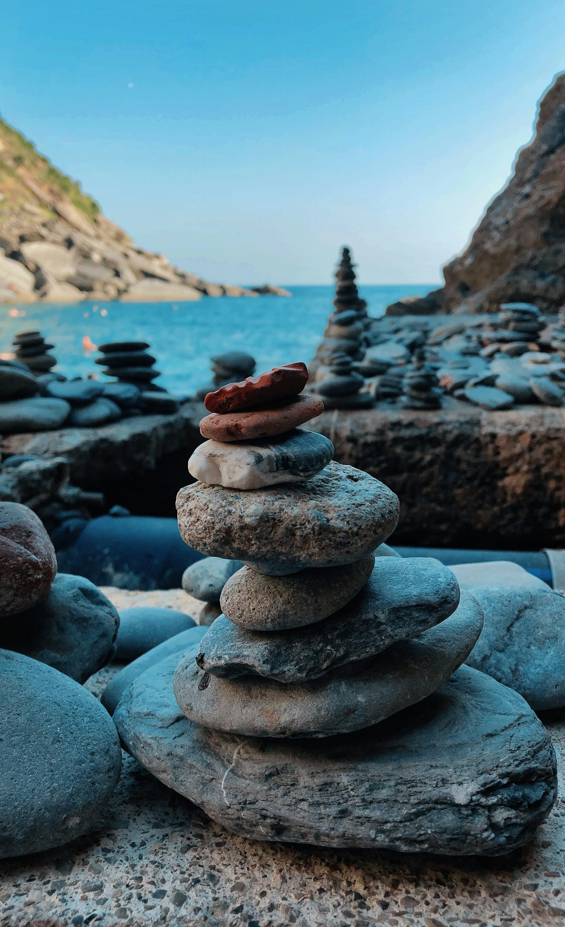 stack of stones on beach during daytime