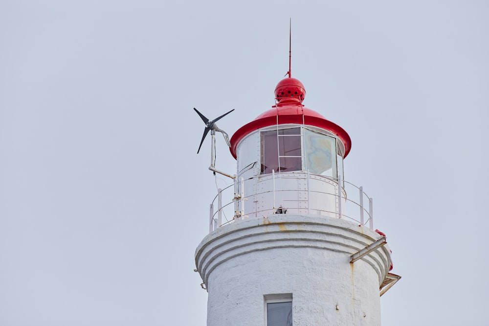 white and red concrete lighthouse