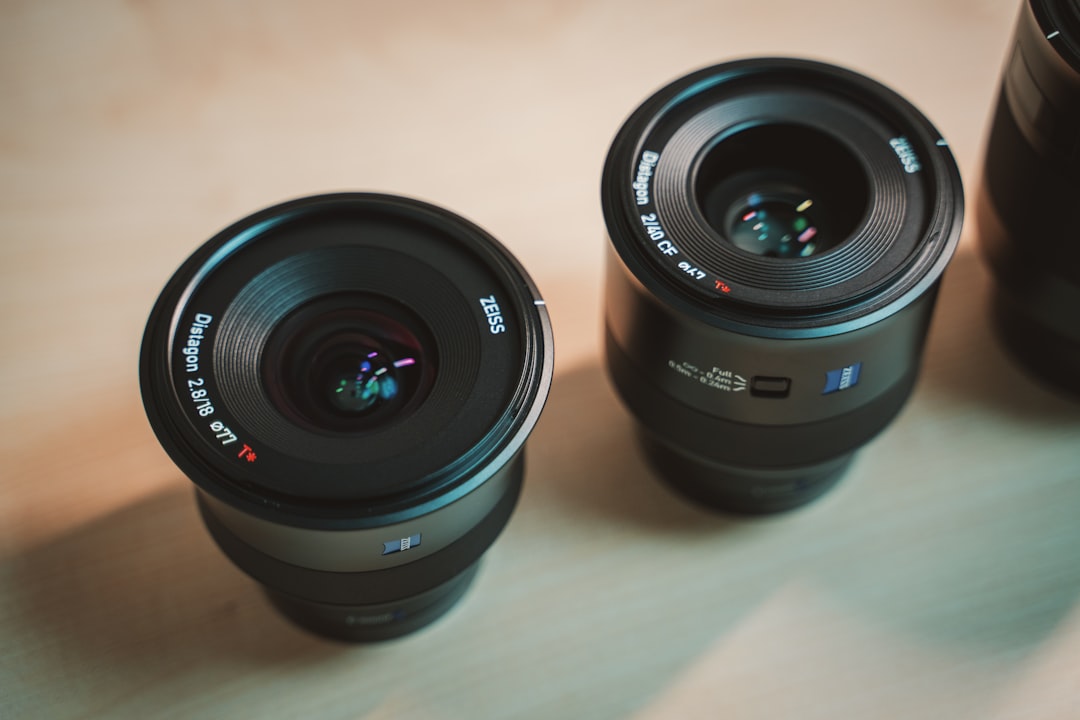 black camera lens on white table