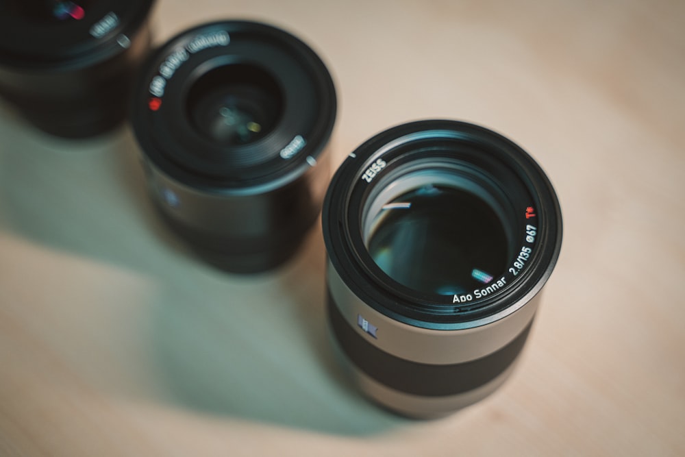 black camera lens on white table