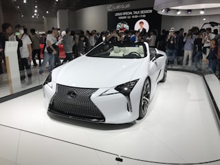 A happy family receiving their new Lexus from Sam Used Car export service.