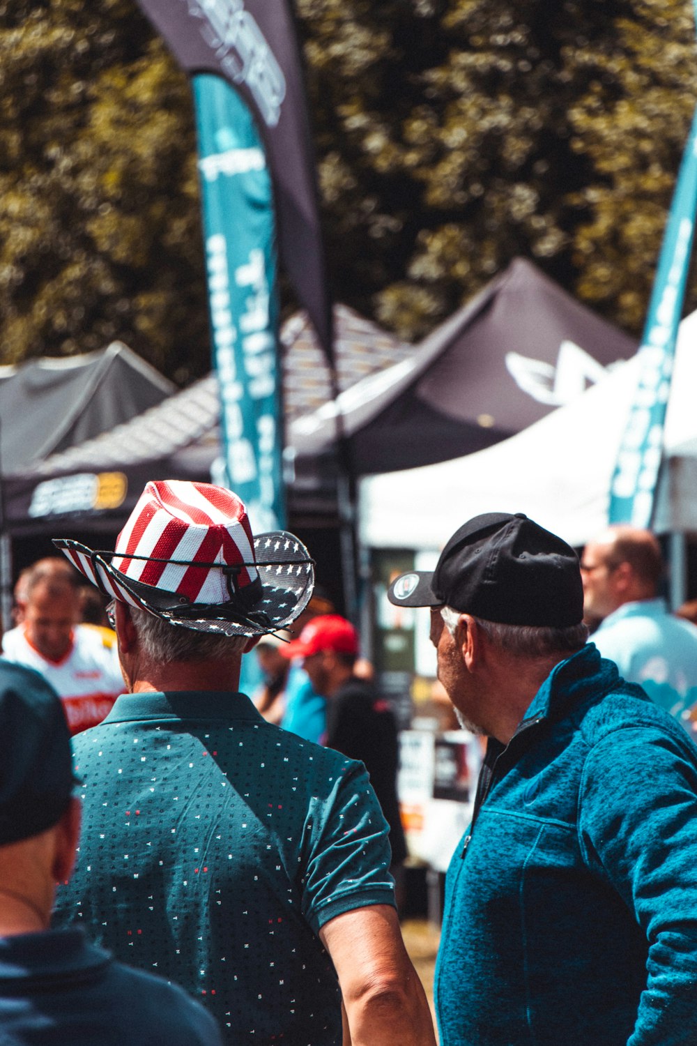 man in blue jacket wearing black cap