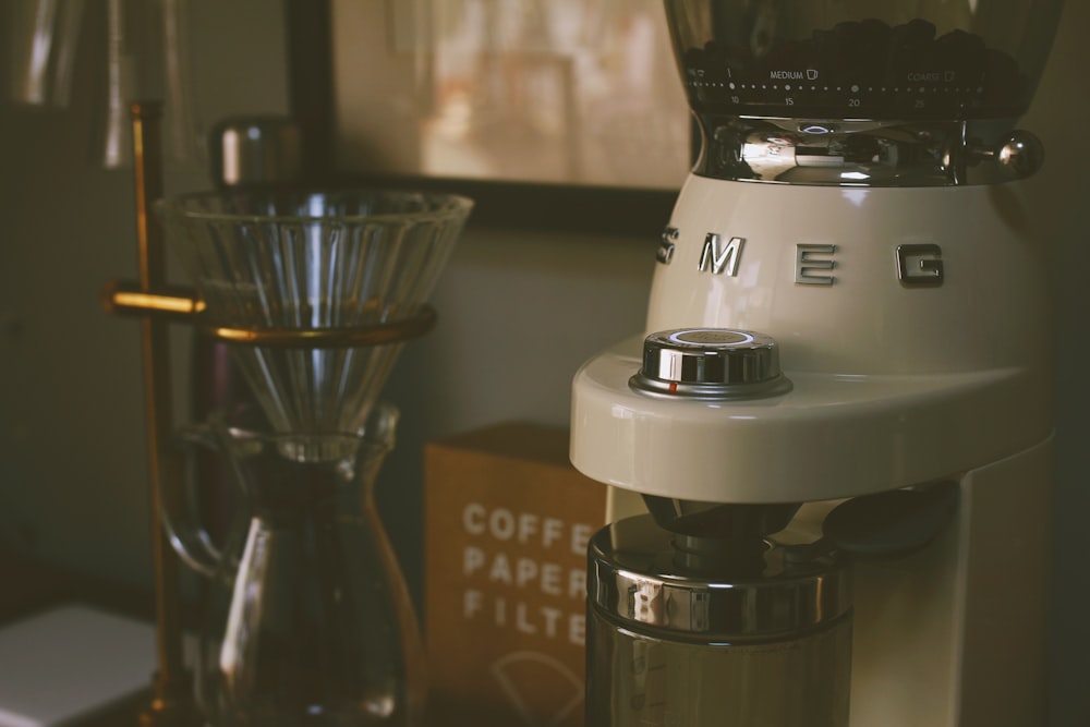 white and black coffee maker