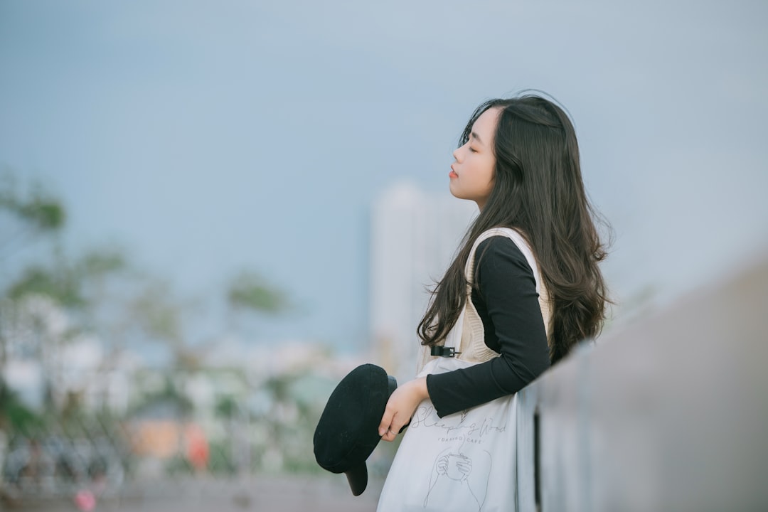 woman in black blazer and white dress