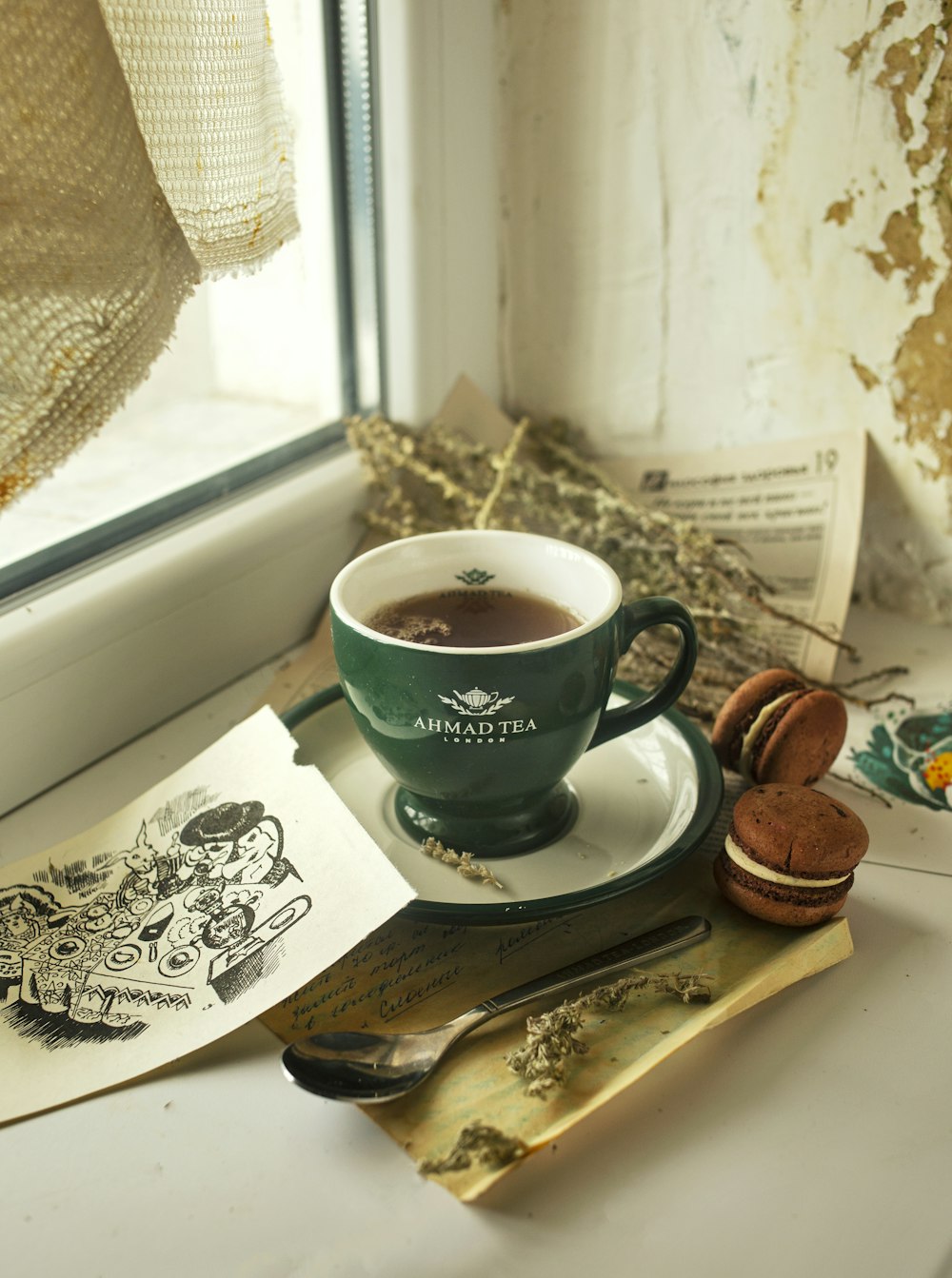 green ceramic mug on brown wooden tray