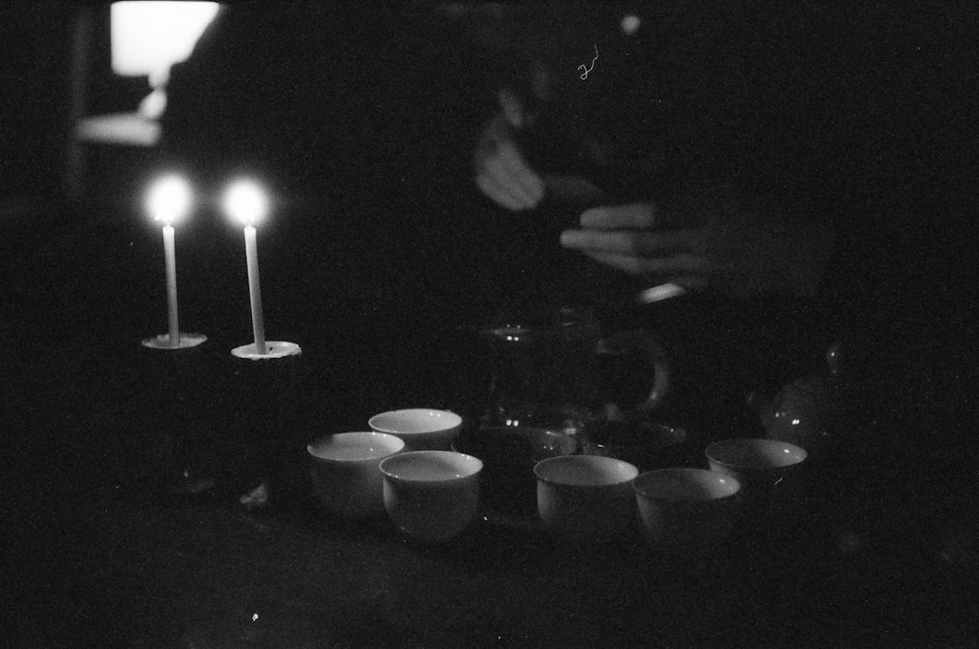 lighted candles on black surface