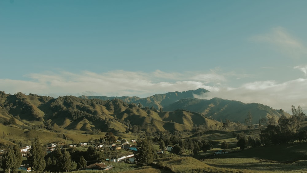 green and brown mountains under blue sky during daytime