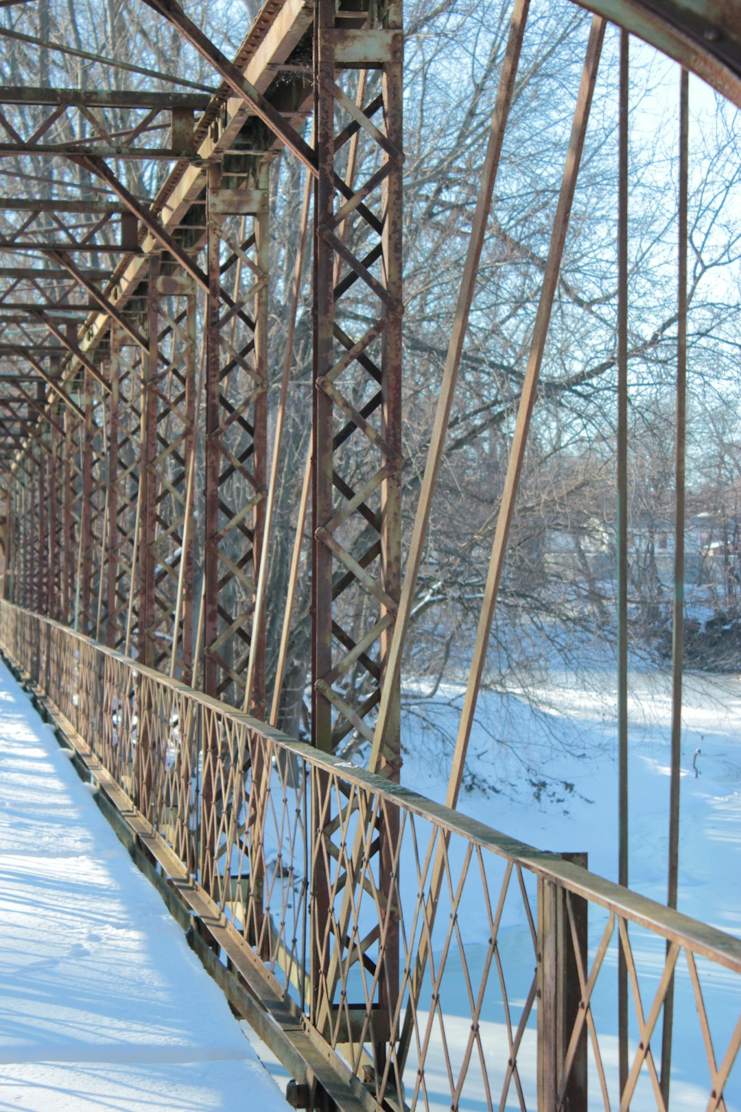 brown wooden bridge over blue sea during daytime