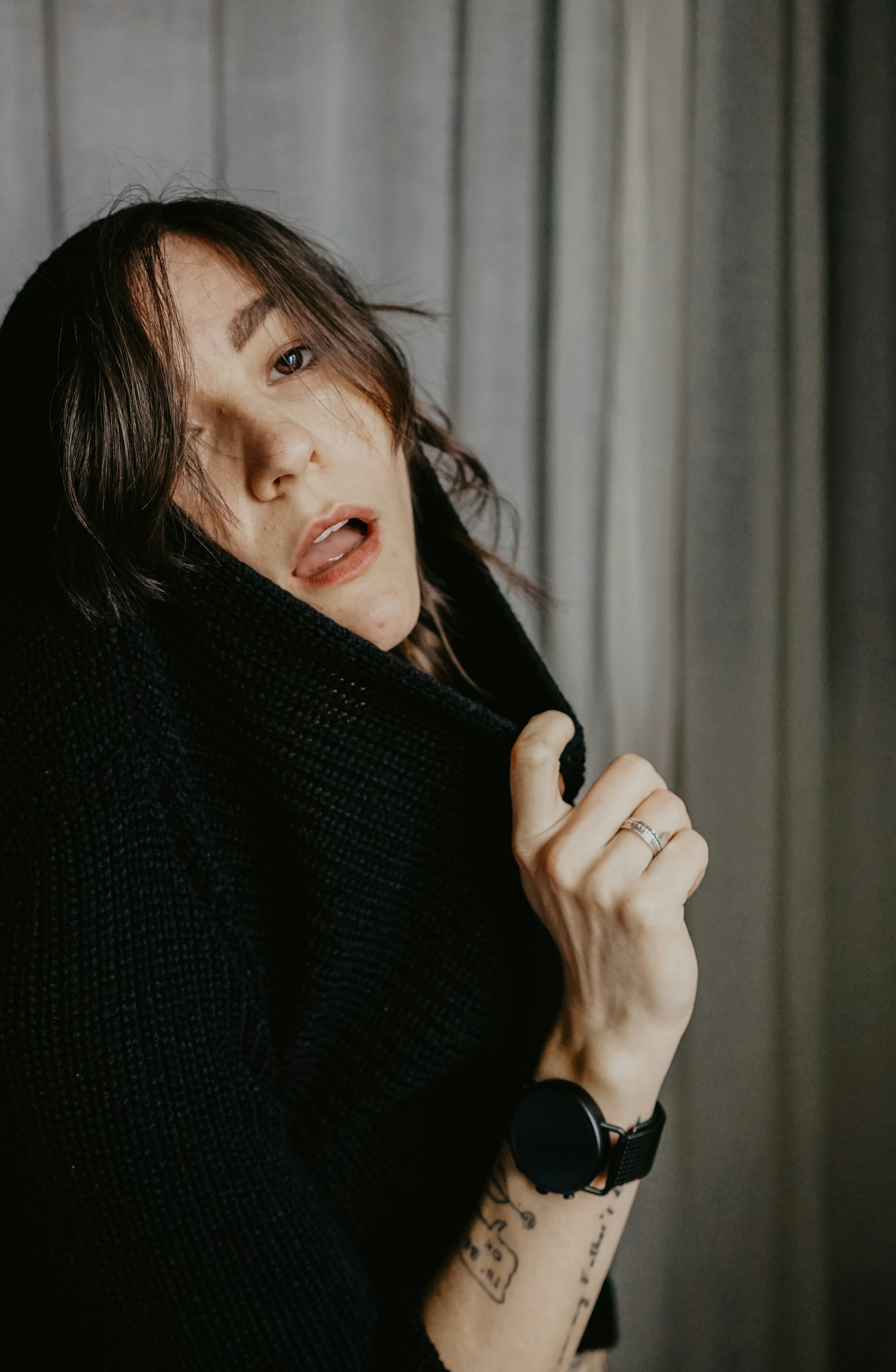 woman in black knit sweater