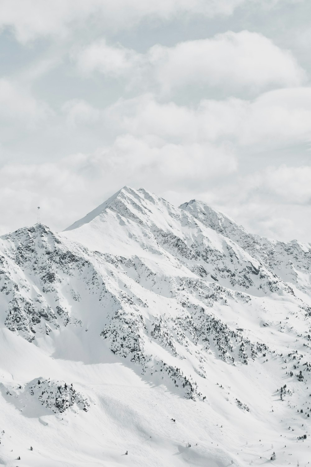 snow covered mountain during daytime