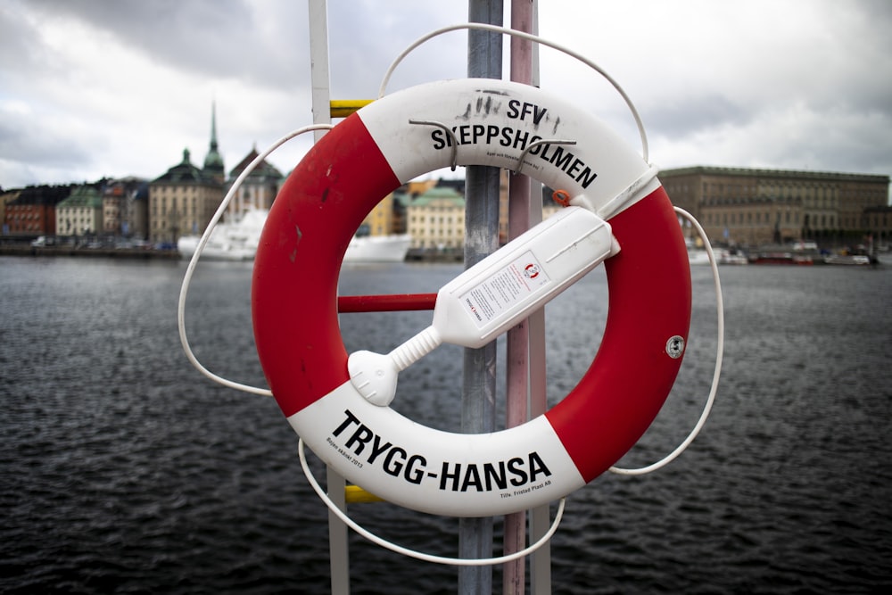 red and white round life buoy