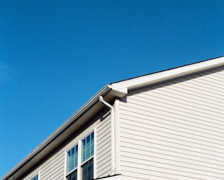 white wooden house under blue sky during daytime
