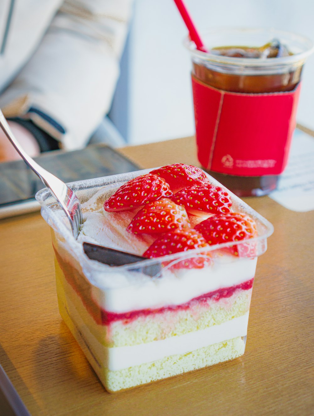 strawberry cake on brown wooden table