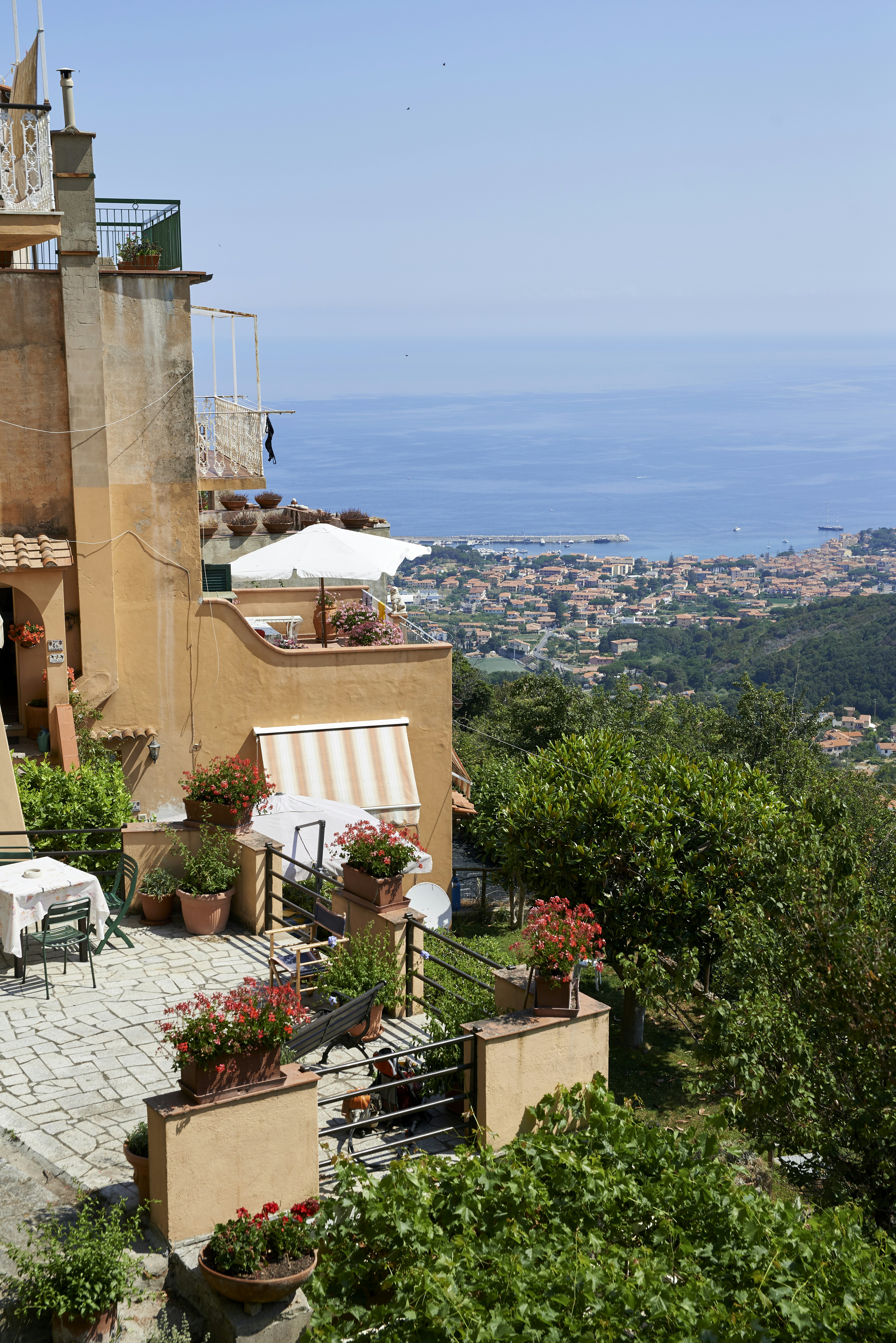 brown concrete building near body of water during daytime