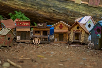 A collection of portable wood buildings displayed in a scenic outdoor setting.