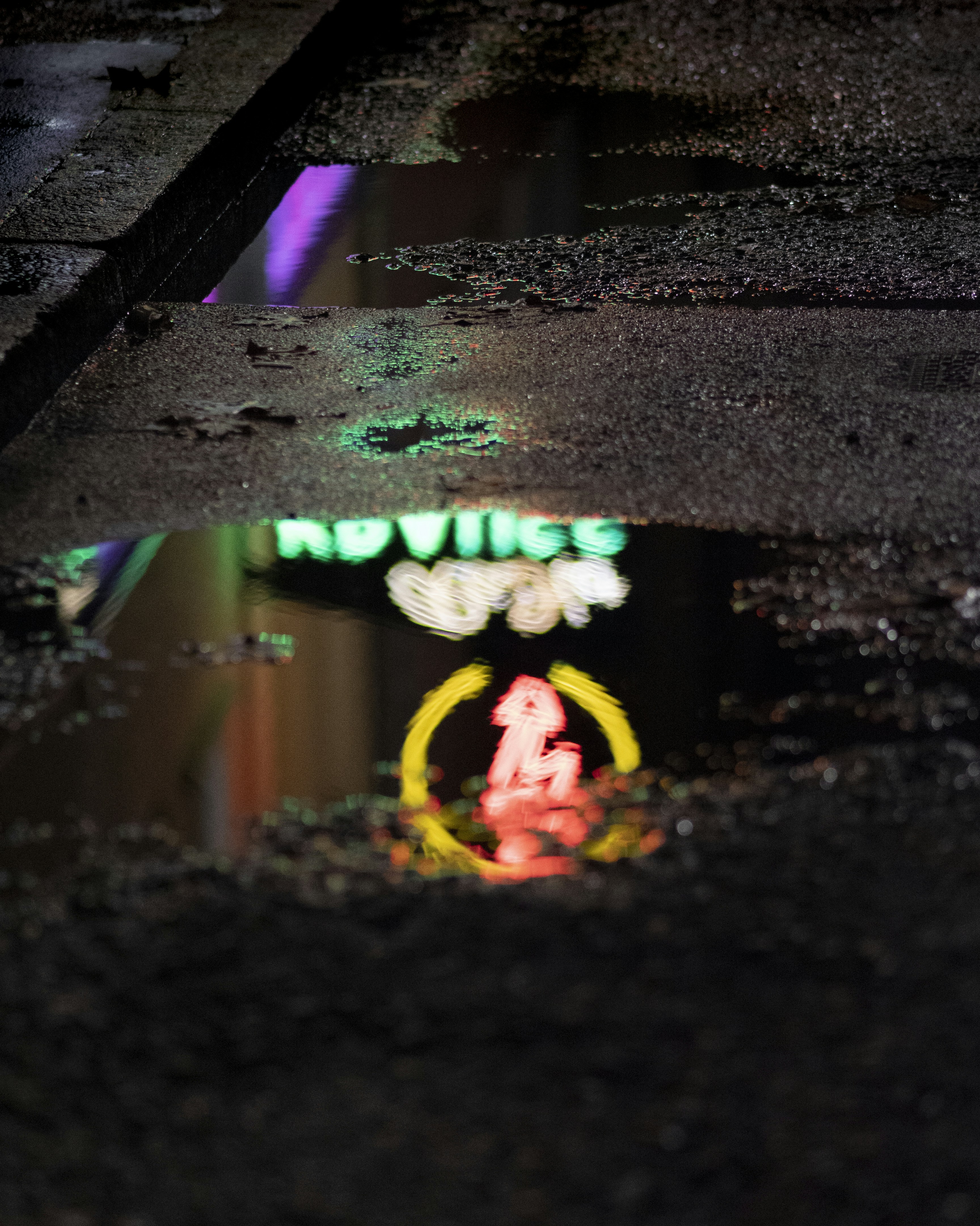 Miami Beach art deco strip at night, dramatic neon reflections on dark wet pavement, moody urban atmosphere