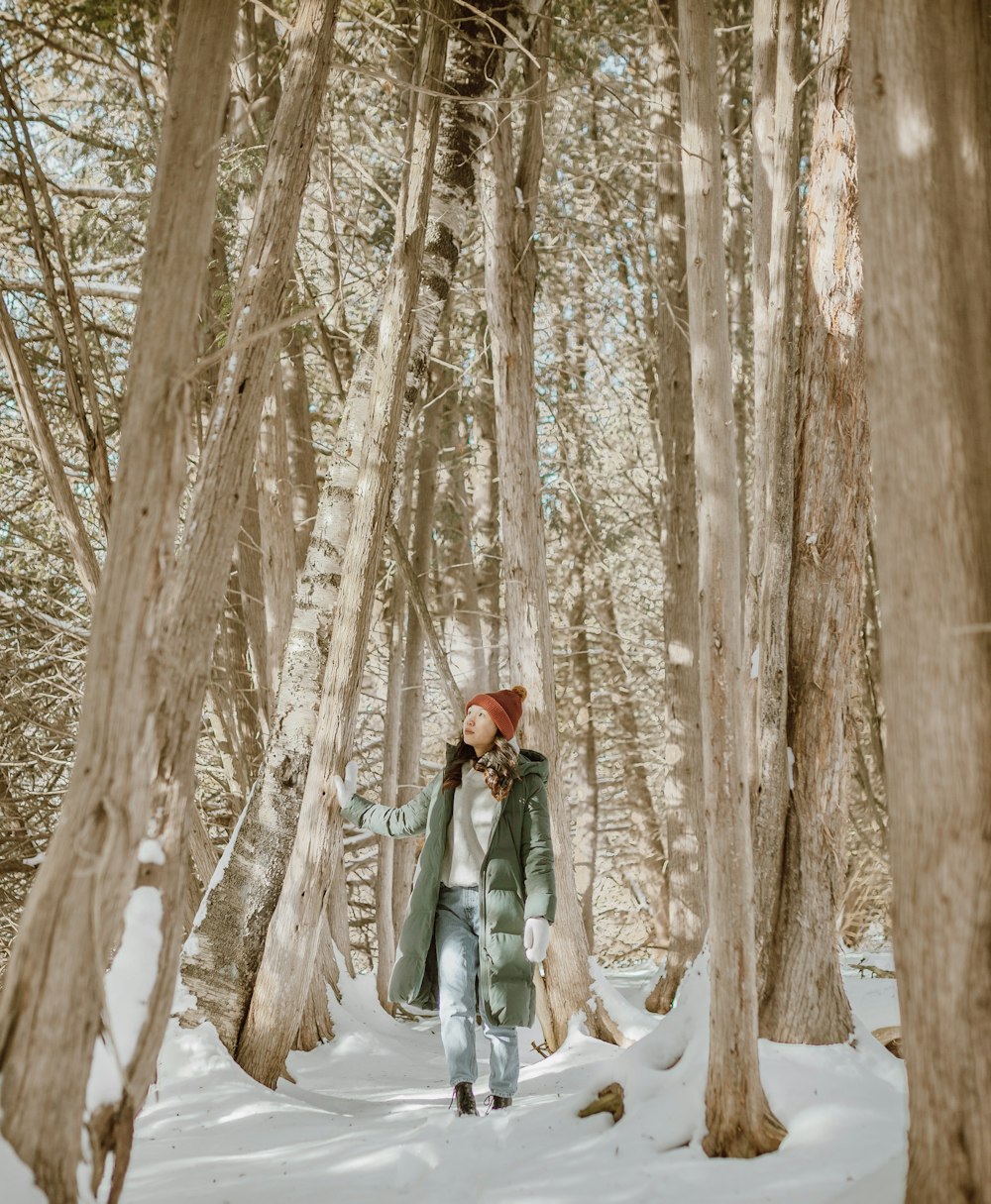 woman in white dress standing on snow covered ground