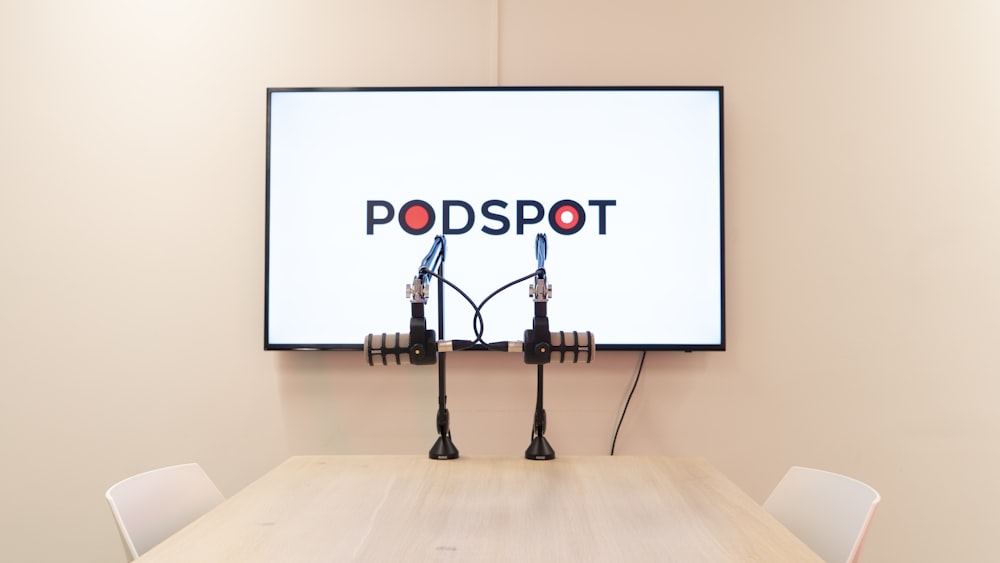 a conference room with two microphones on the wall