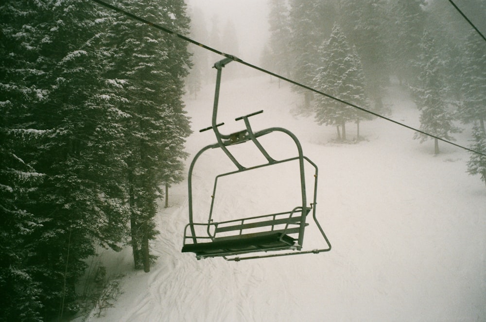 green metal frame on snow covered ground