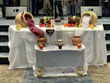 Ancient Roman feast setup featuring terracotta dishes and ornate oil lamps.
