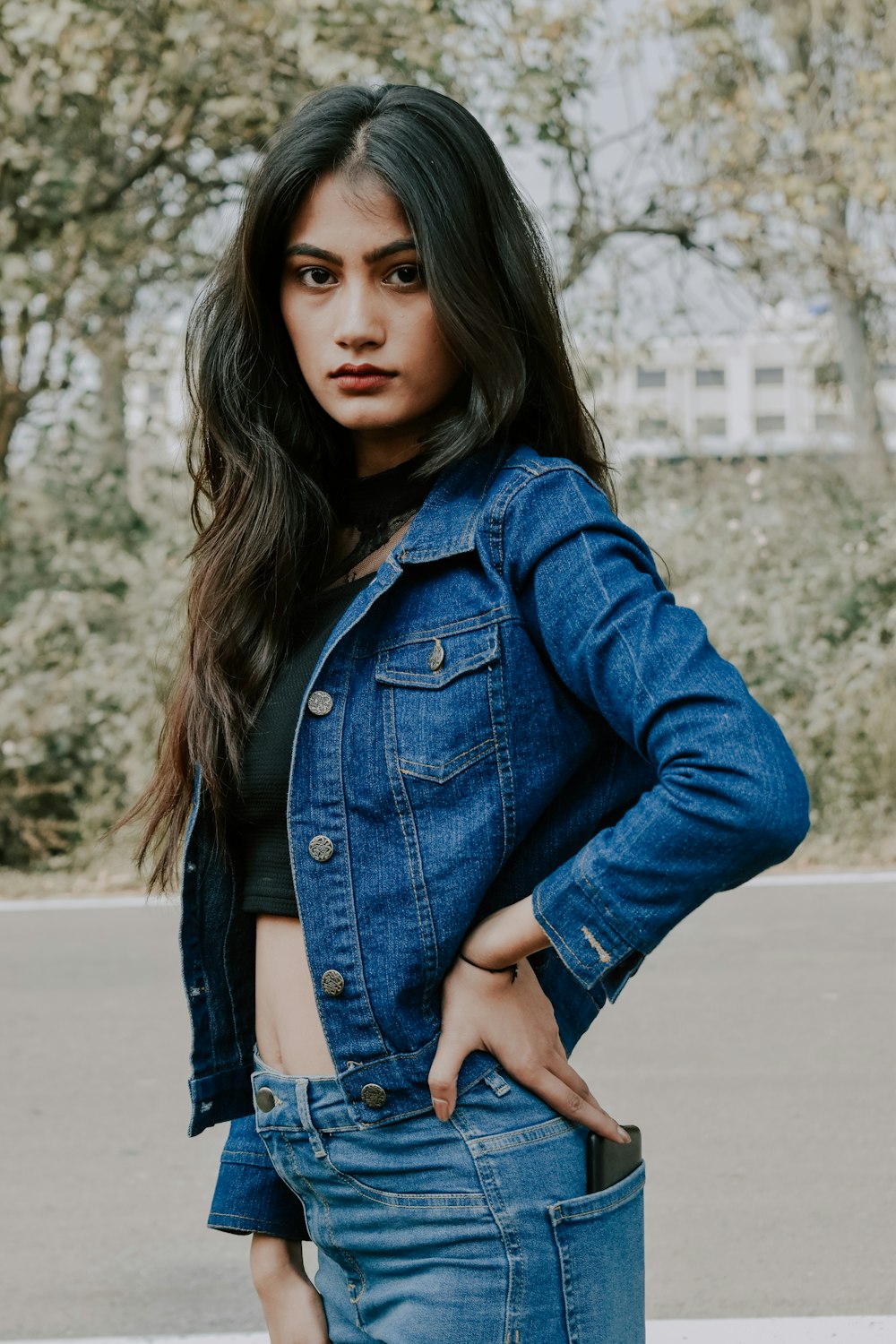 Woman in blue denim jacket standing on road during daytime photo – Free  Apparel Image on Unsplash