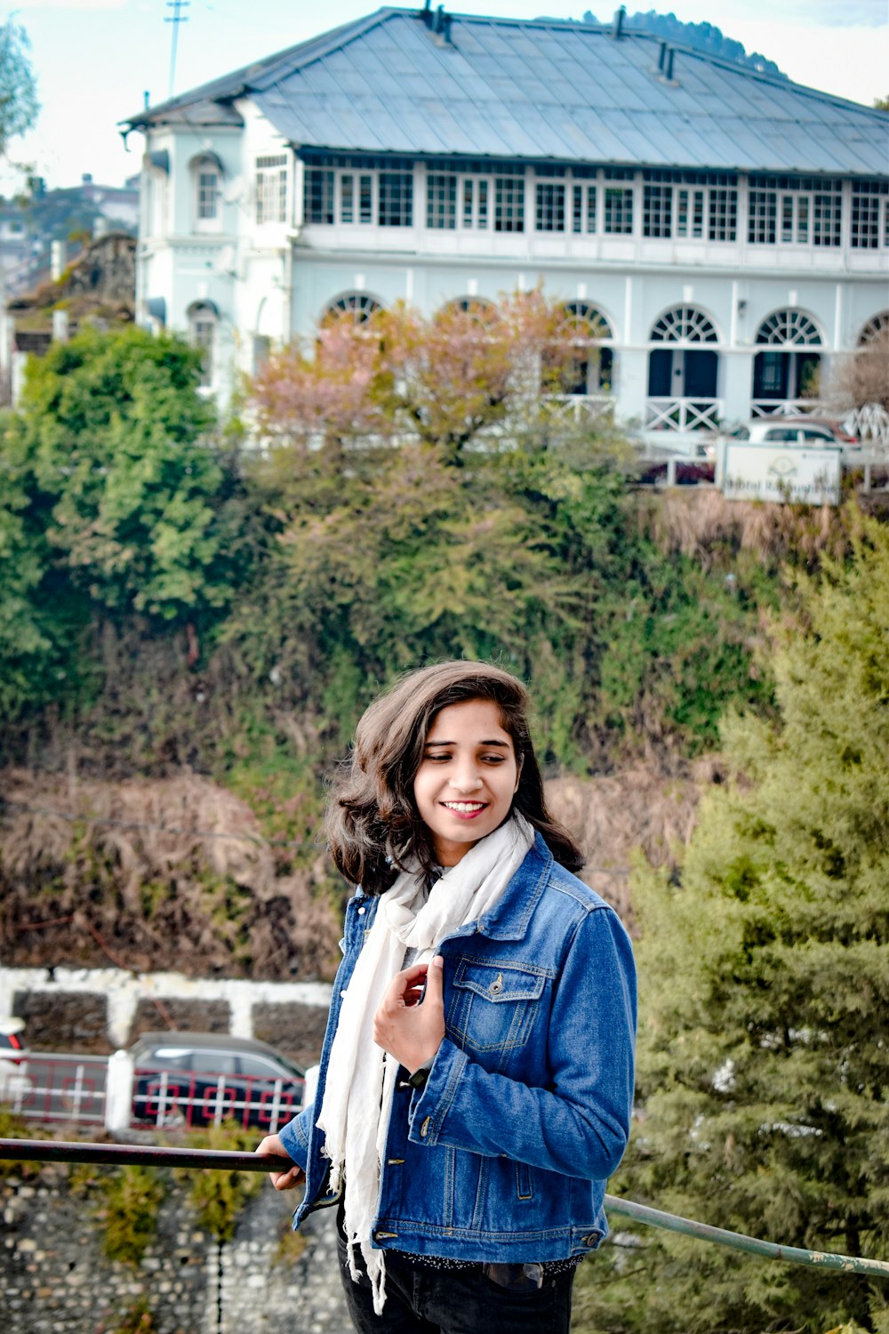 woman in blue denim jacket smiling