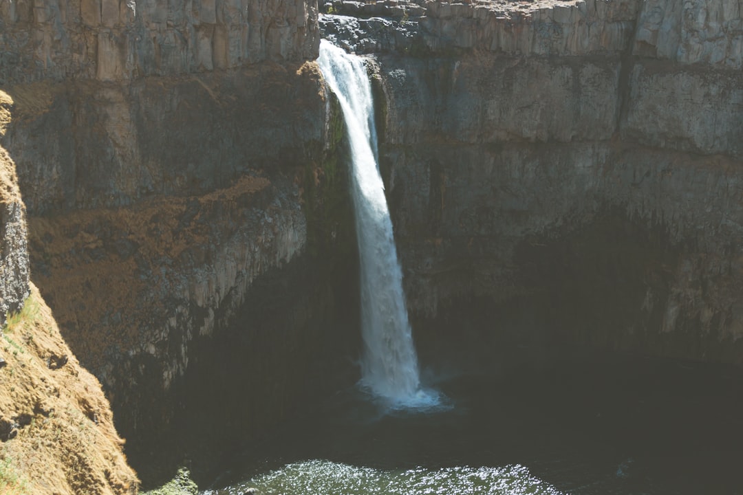 water falls on rocky mountain