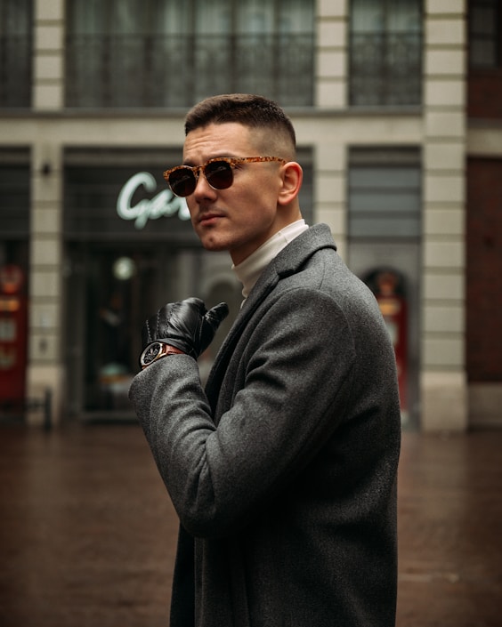 man in black suit wearing sunglasses