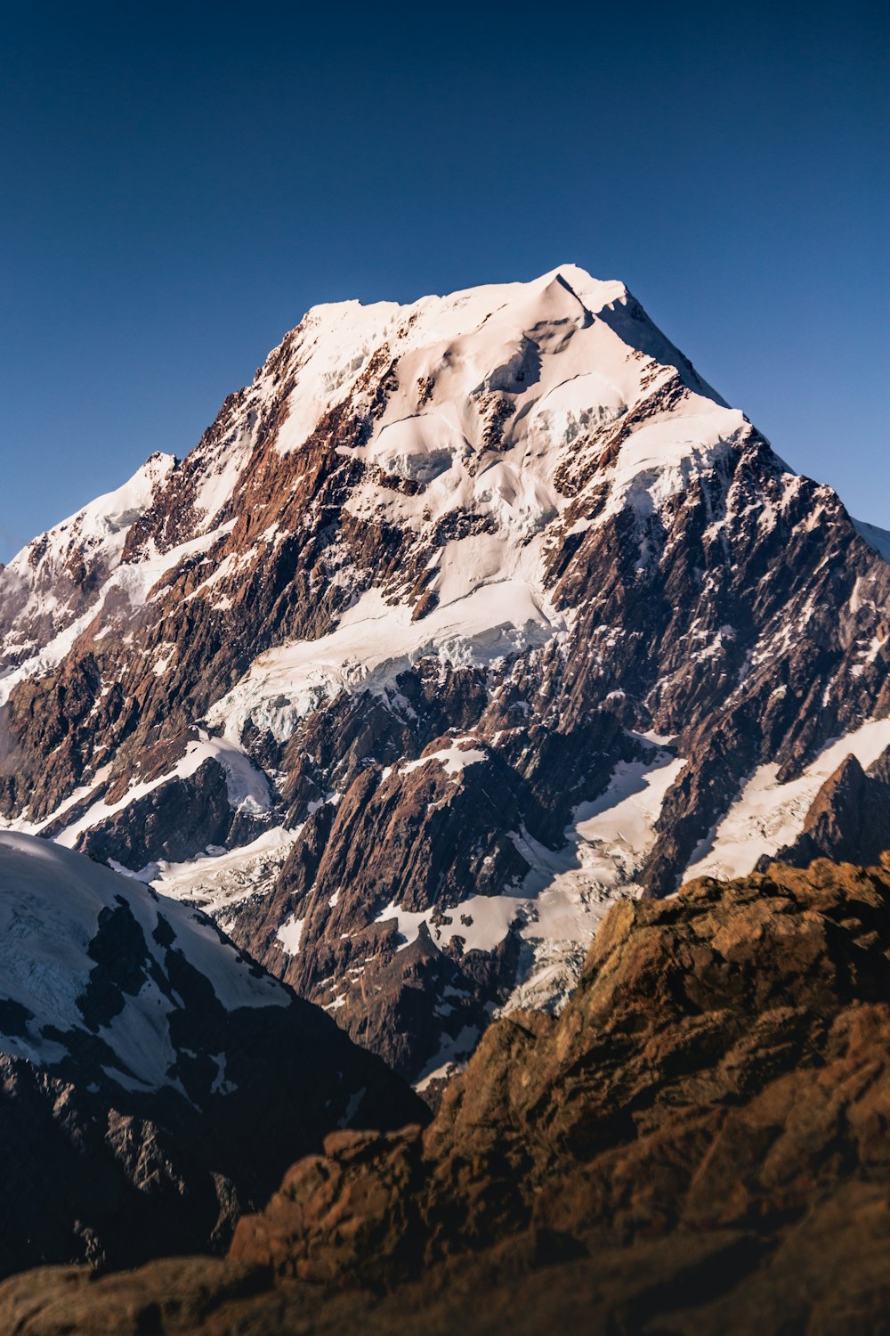 snow covered mountain under blue sky during daytime