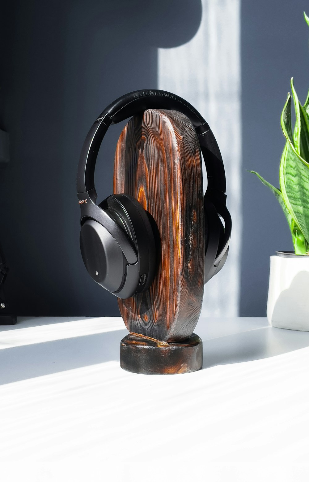 brown and black headphones on white table