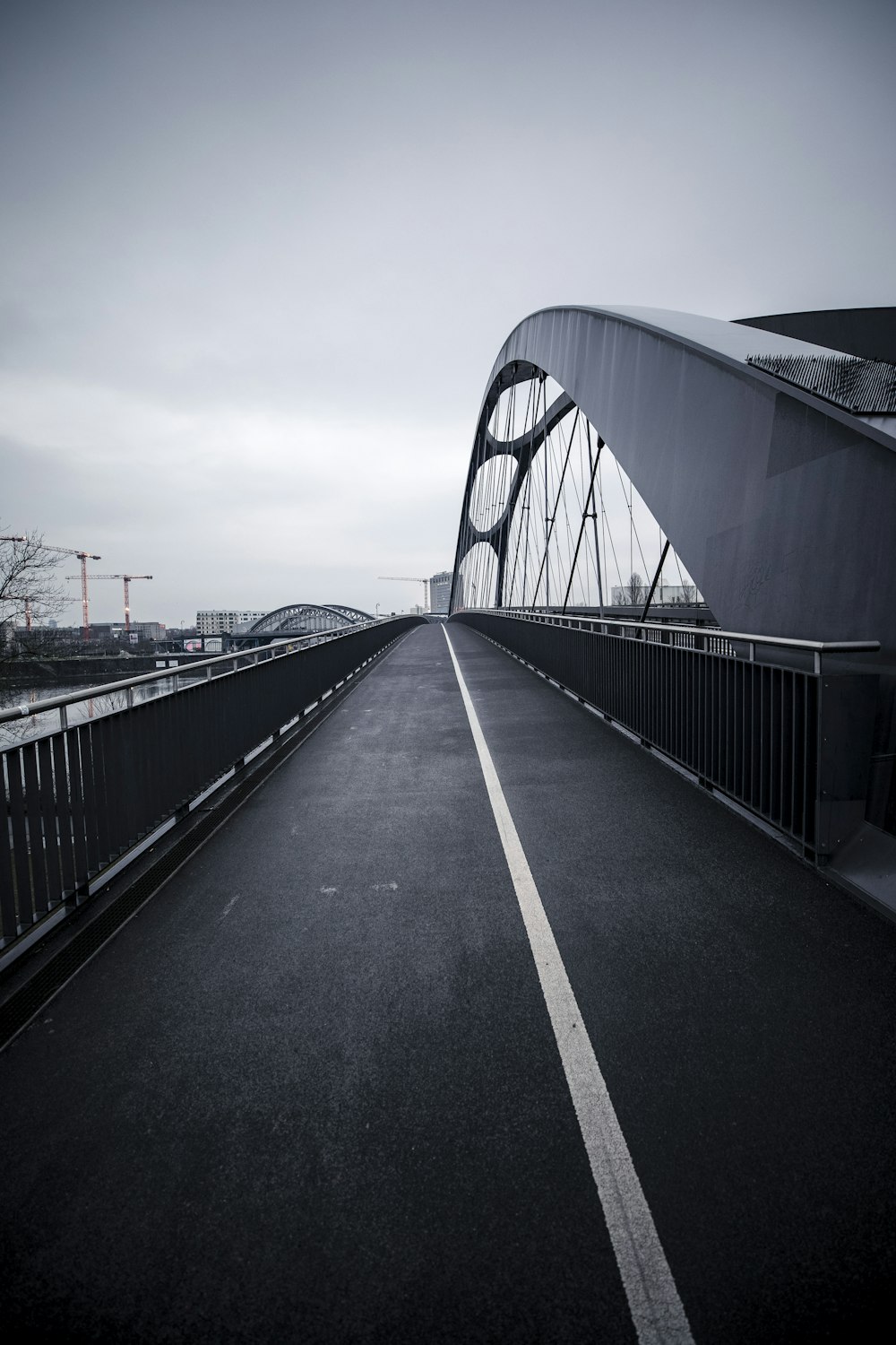 gray concrete bridge under gray sky