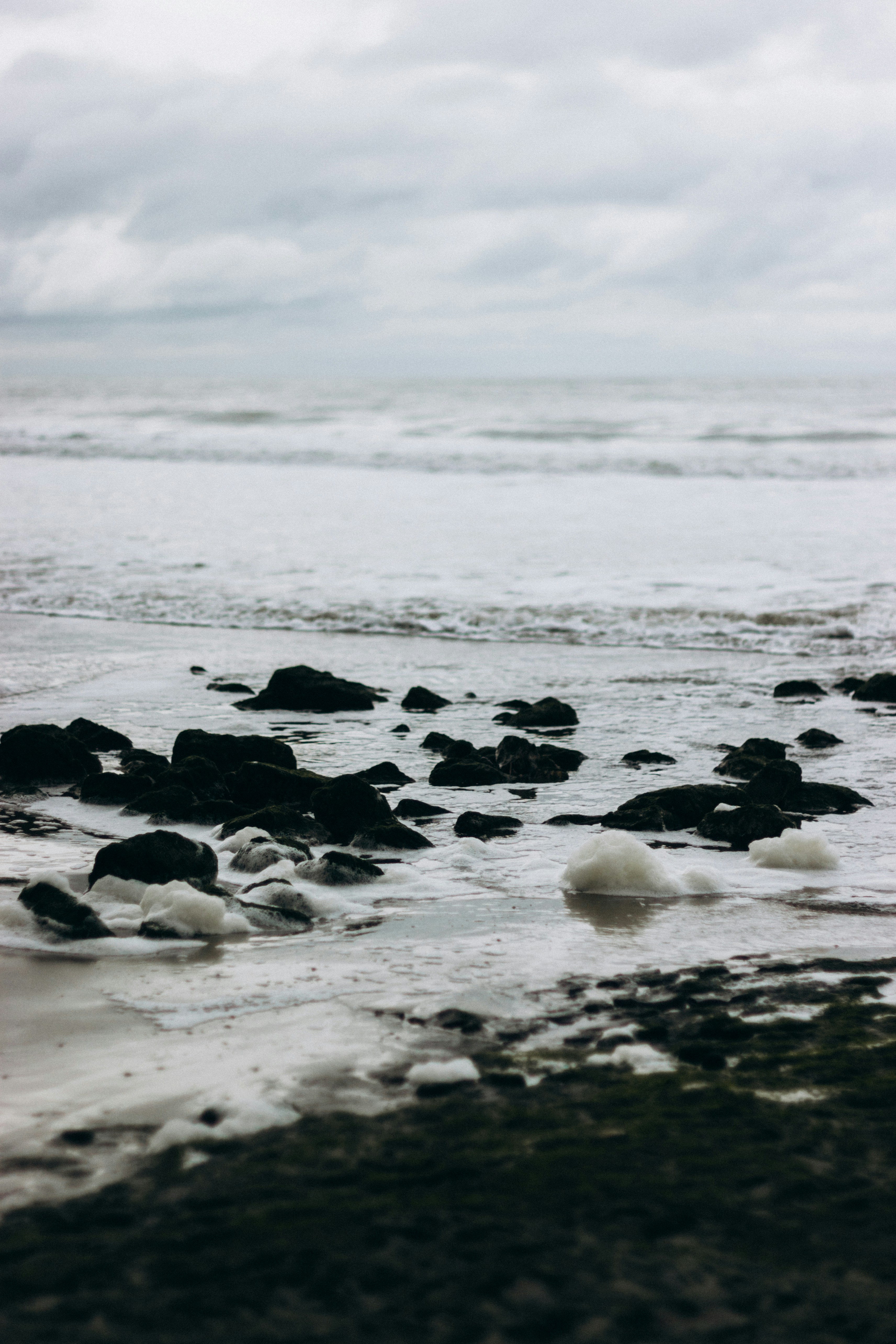 black and white stones on seashore during daytime