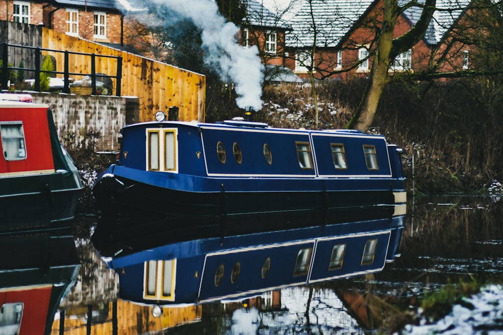 blue and white train on rail tracks during daytime