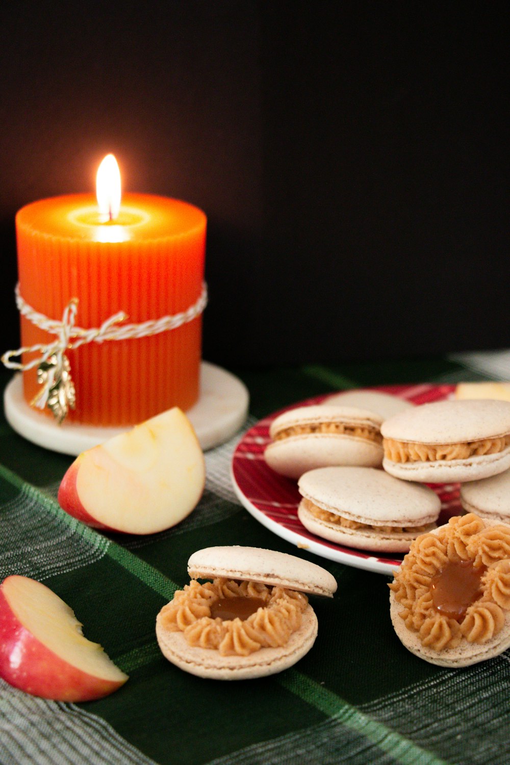 red and white candles on white ceramic saucer