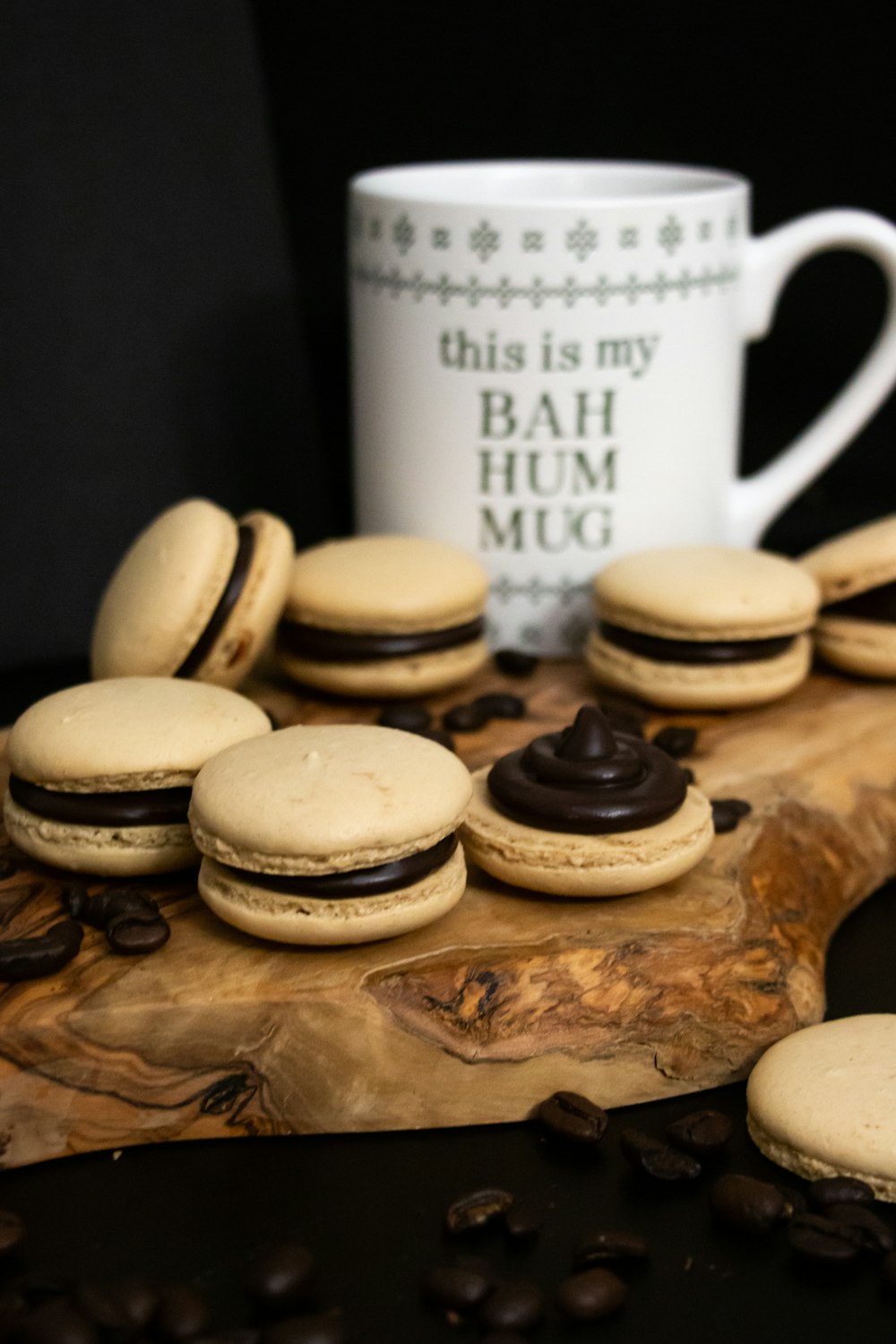 white ceramic mug beside cookies