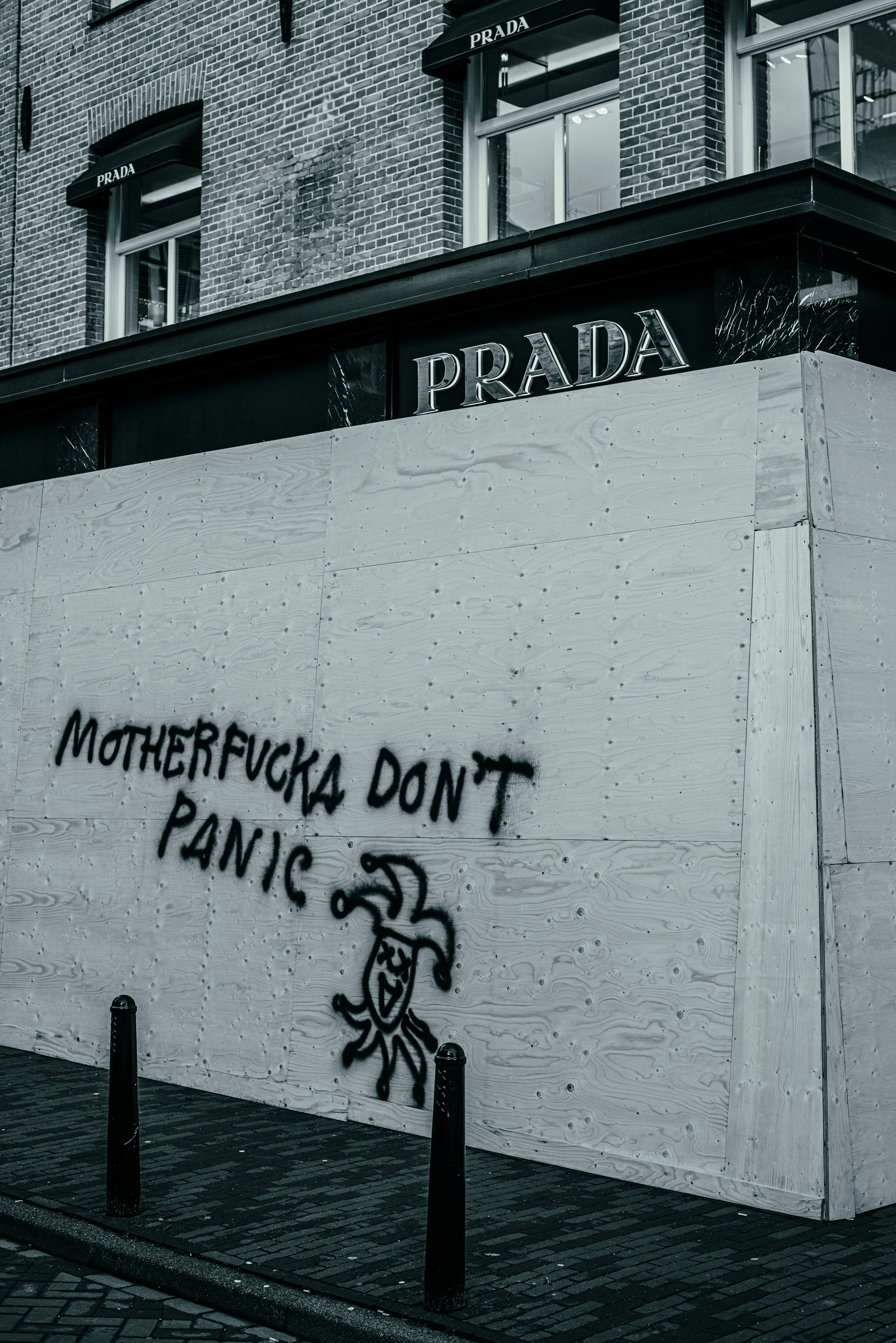 Prada store in PC Hooftstraat in Amsterdam protect themselves against rioters.