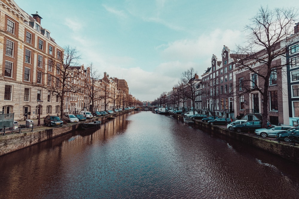 boat on river near buildings during daytime