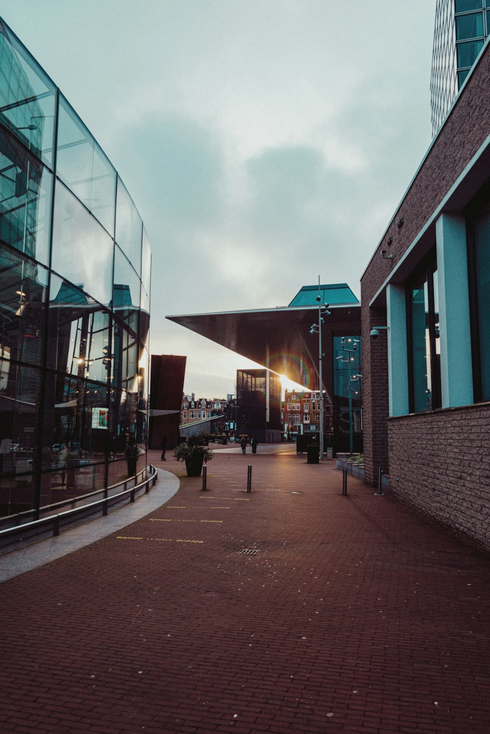 people walking on sidewalk near building during daytime