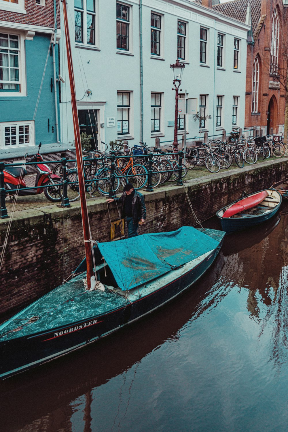 people on boat on river during daytime