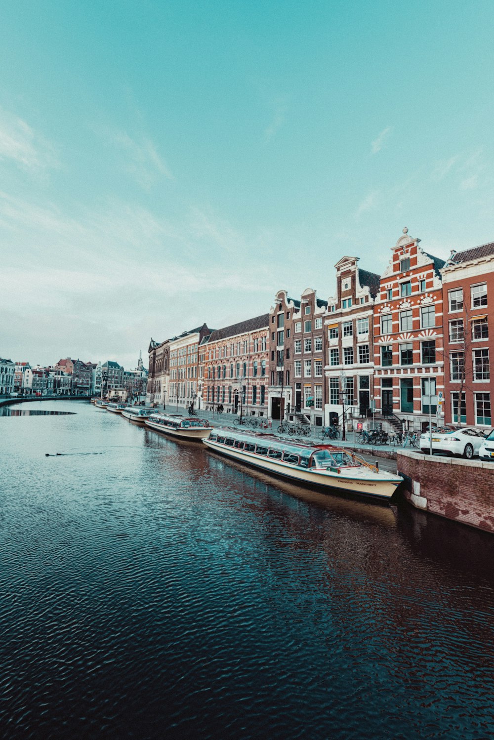 boat on water near buildings during daytime