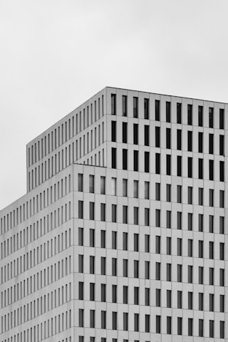 white concrete building under white sky during daytime