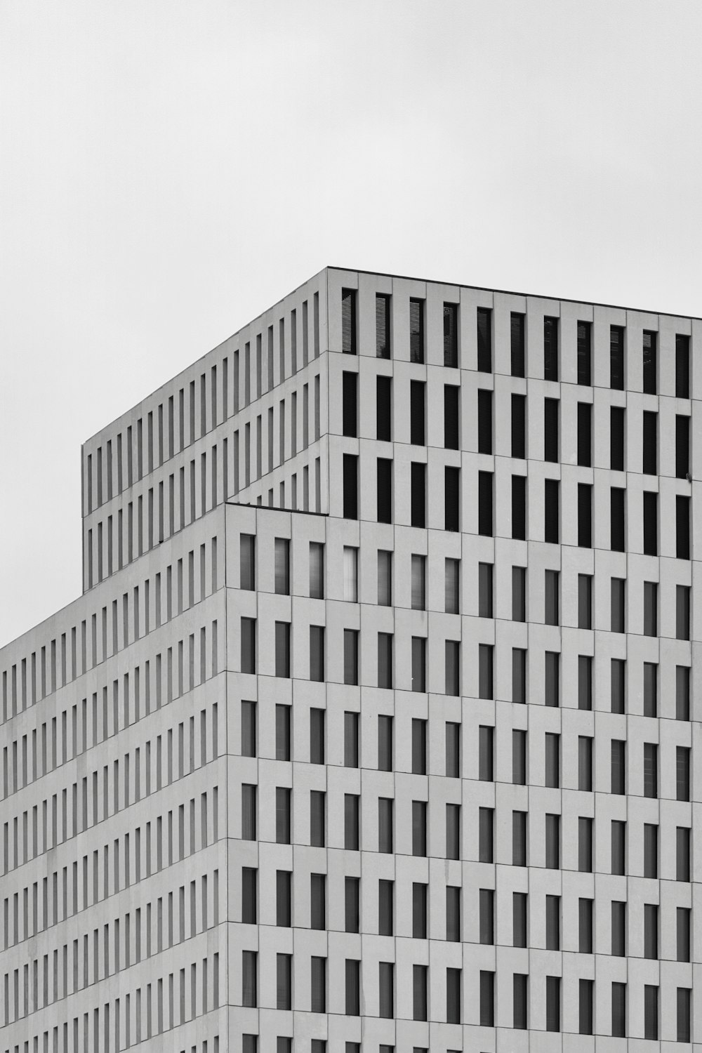 white concrete building under white sky during daytime