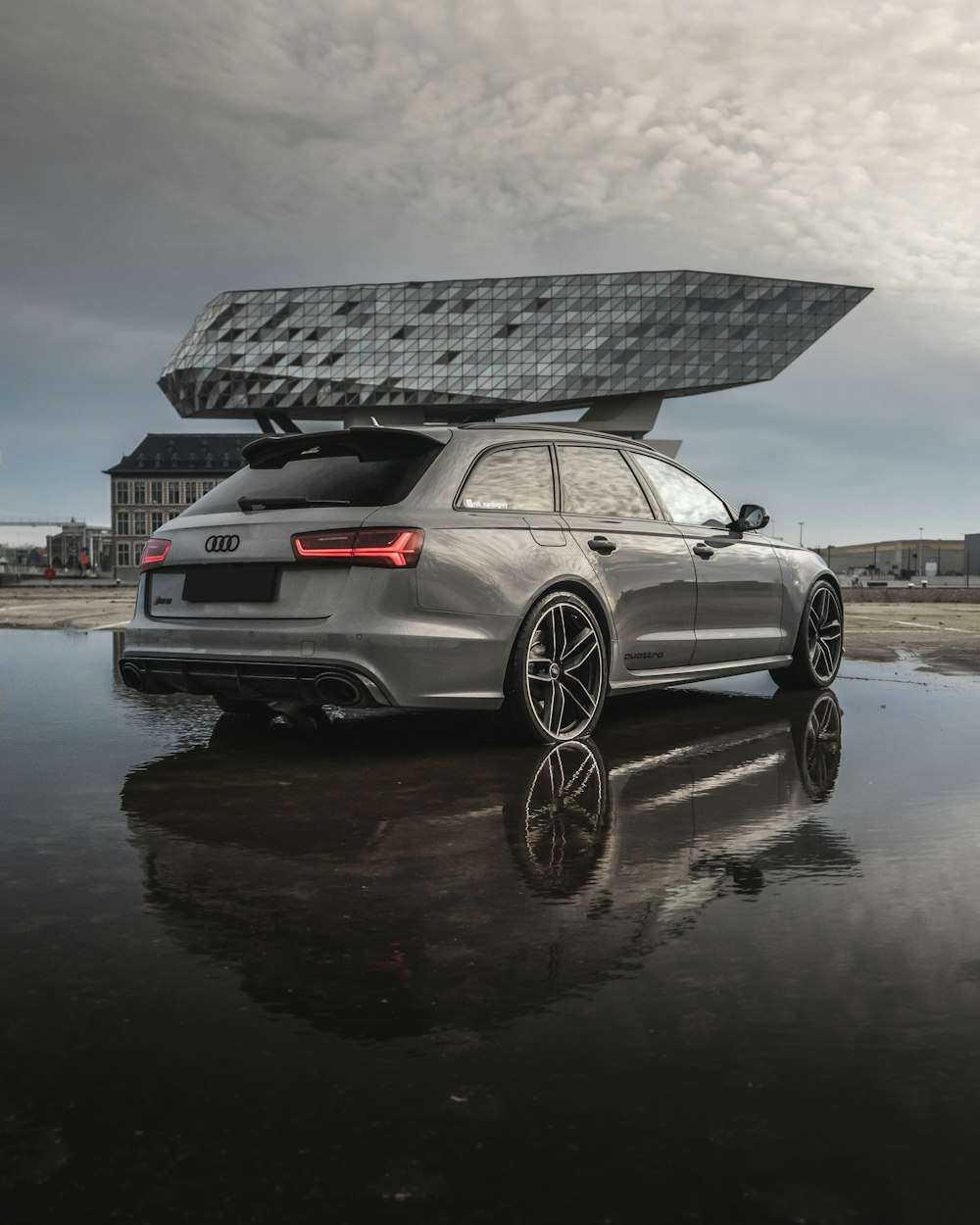 silver bmw m 3 parked on water