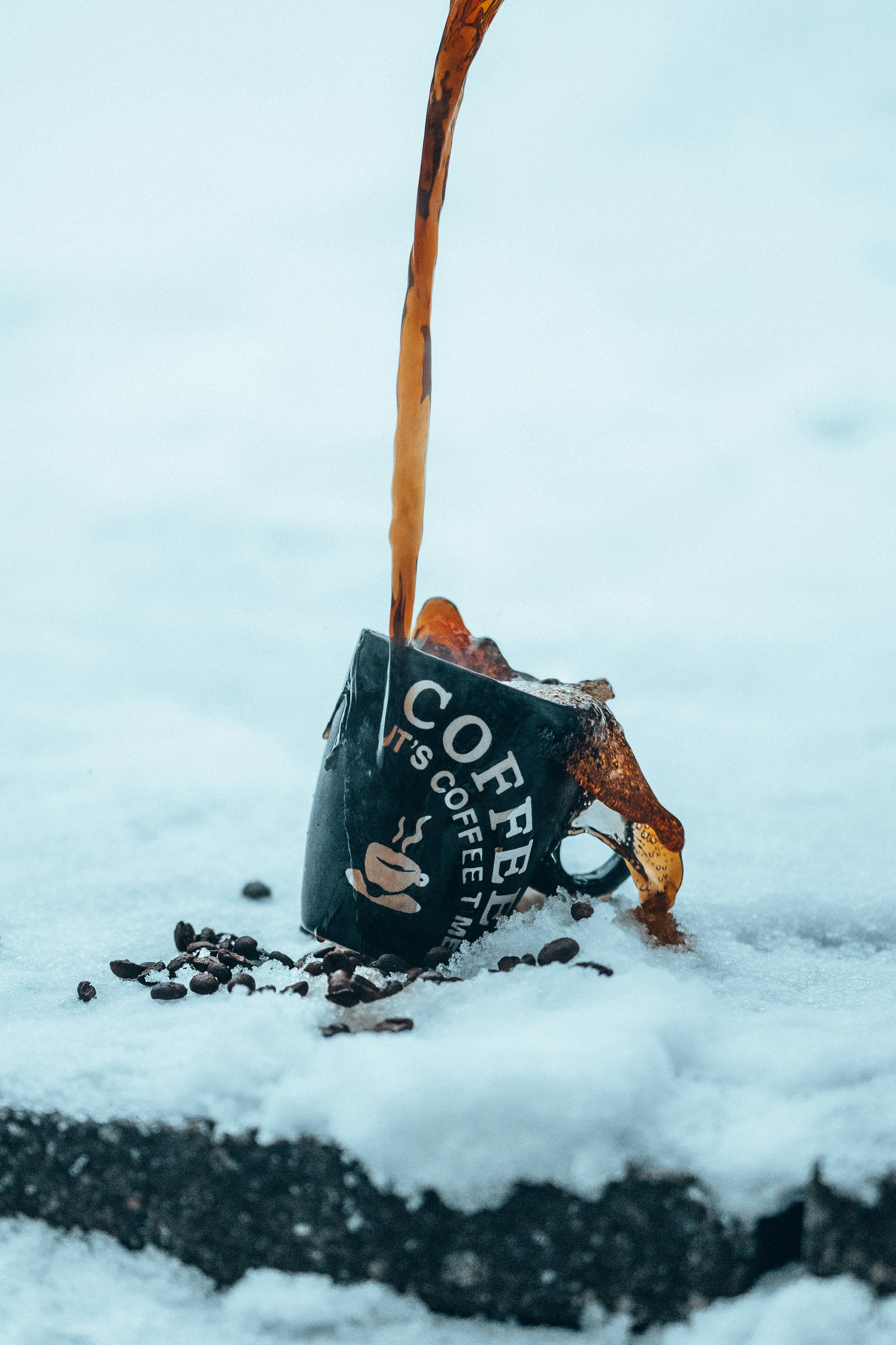 black and white jack o lantern bucket on snow covered ground