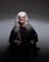 woman in black coat wearing eyeglasses