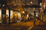 Ben Lanes storefront with welcoming signage and warm lighting at dusk.