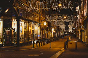 Ben Lanes storefront with welcoming signage and warm lighting at dusk.