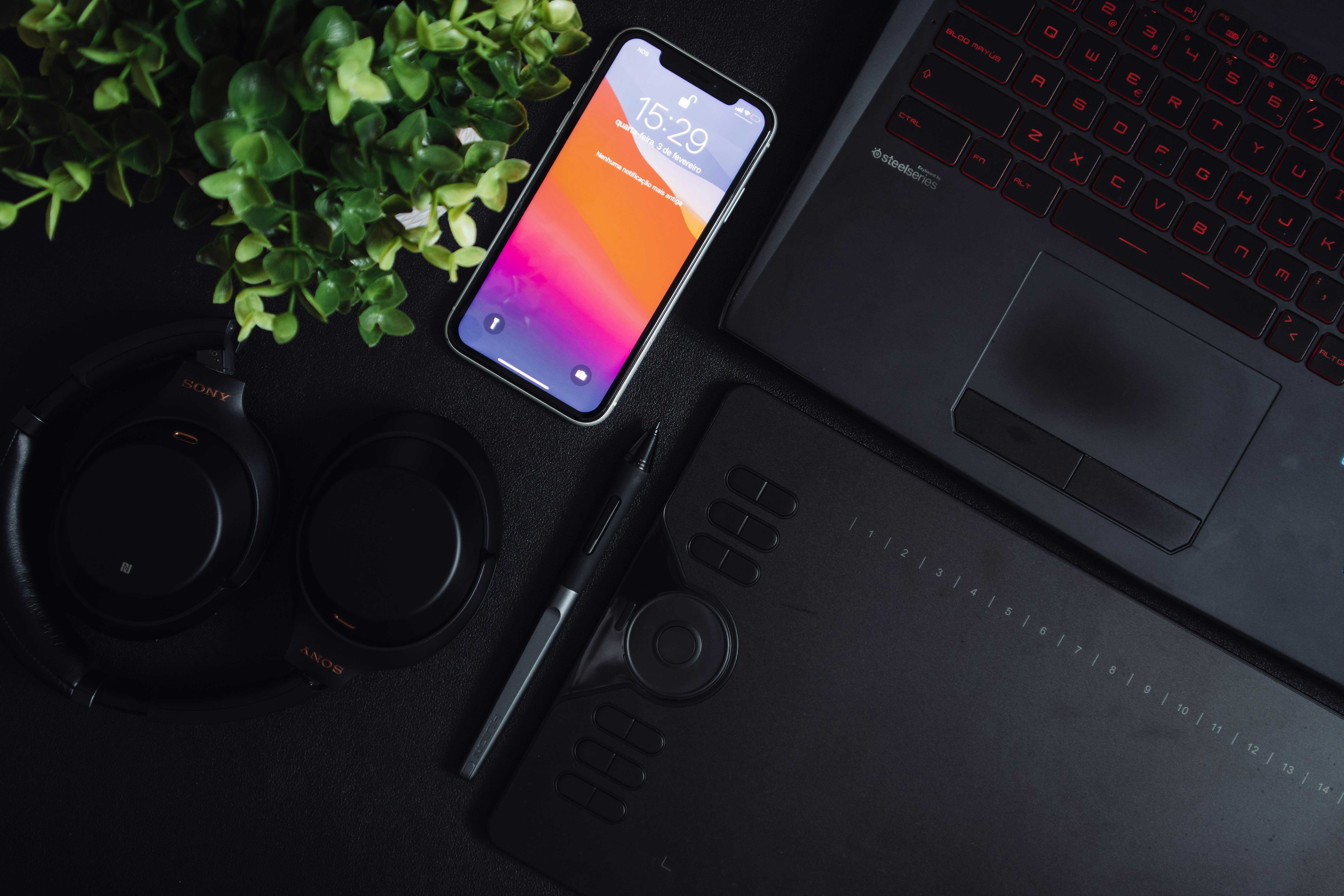 iPhone on black laptop computer